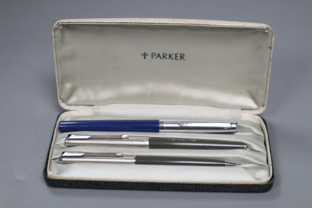 A Parker fountain pen and propelling pencil marked PM Thatcher and Easterbrook pen